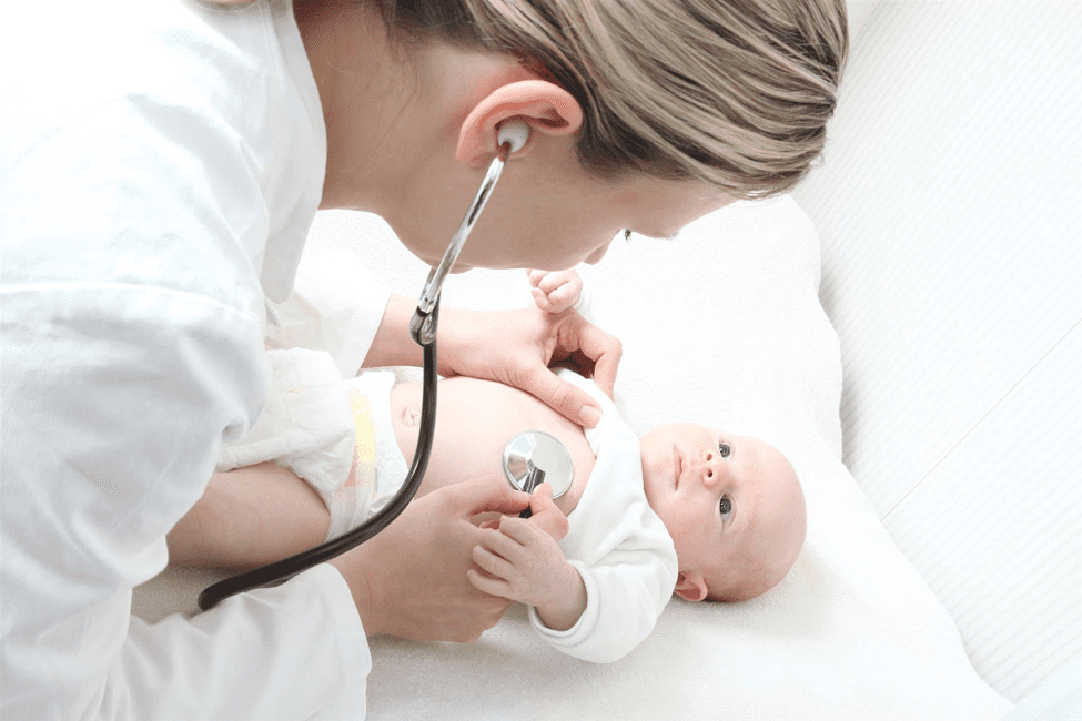 Doctor doing check-up on baby