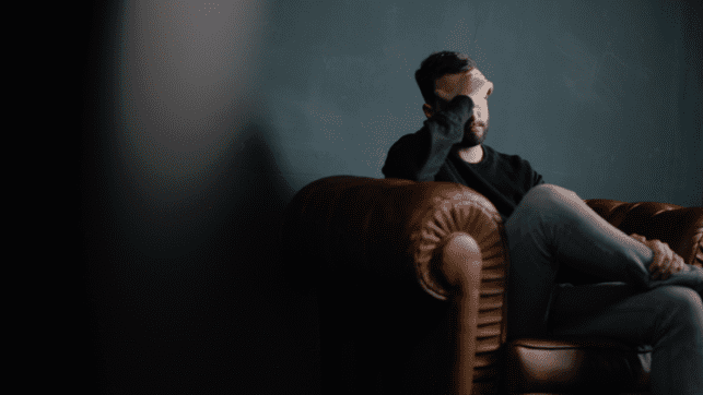 Inhalant Addiction Destroys and Takes Lives Depressed Man Sitting on Chair
