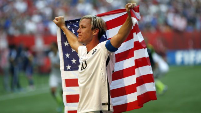 Soccer Star Abby Wambach Speaks Out About Her Sober Life Abby Wambach Holding American Flag