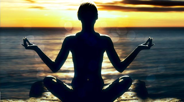 Meditation: A Holistic Approach to Addiction Recovery in Delray Beach Woman Meditating On Beach Looking at Sunset