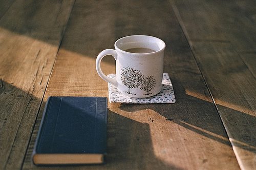 Cup of Coffee on Wood Floor