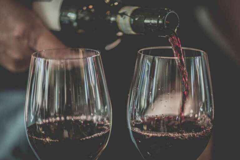 Wine Poured into Two Wine Glasses