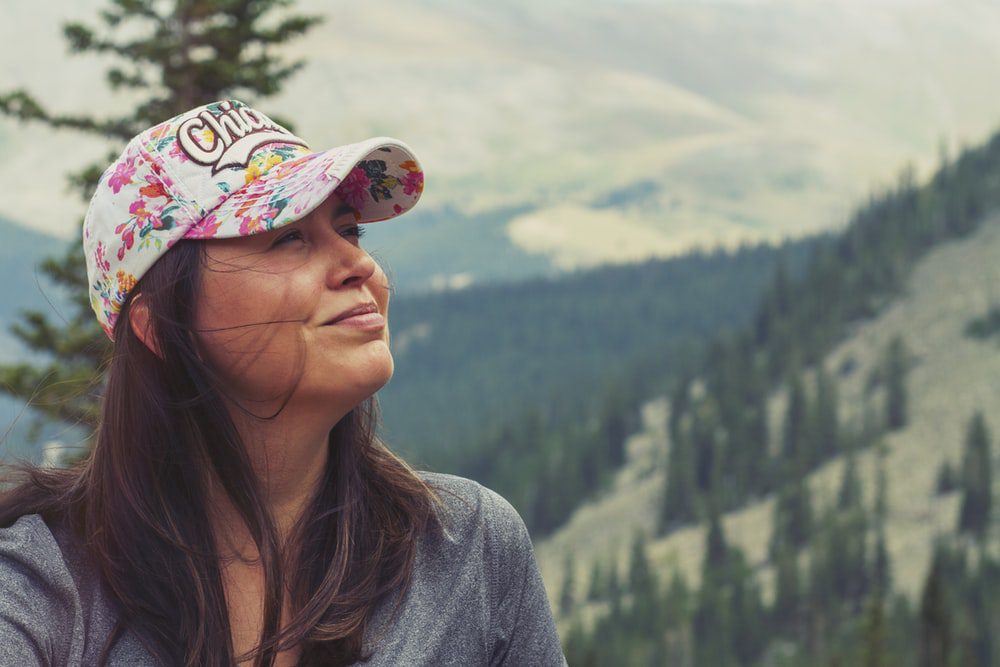 woman taking selfie on mountain